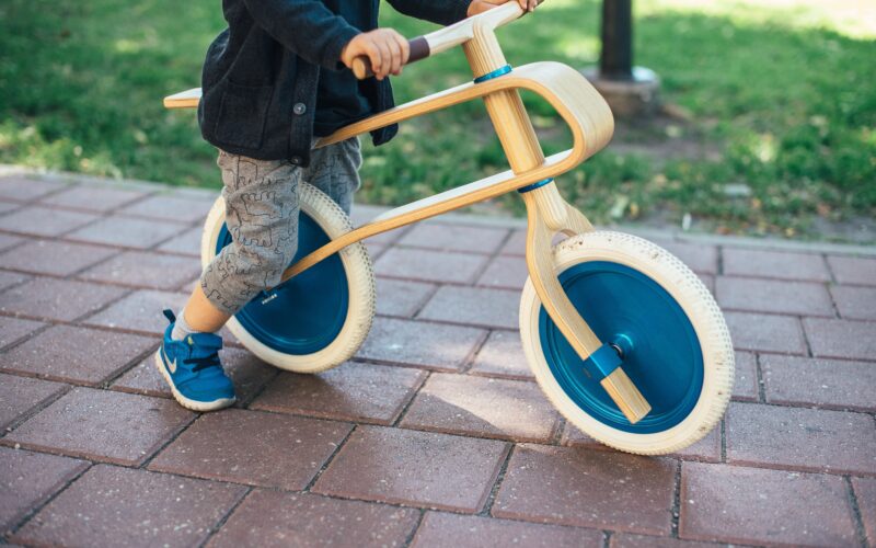 Toddler riding a balance bike